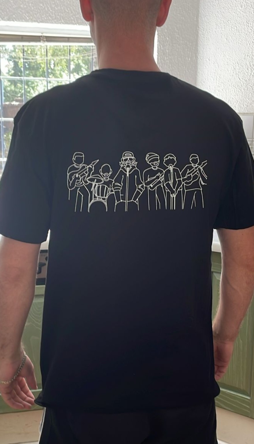 Back of black Sons of Jericho T-shirt with band illustration